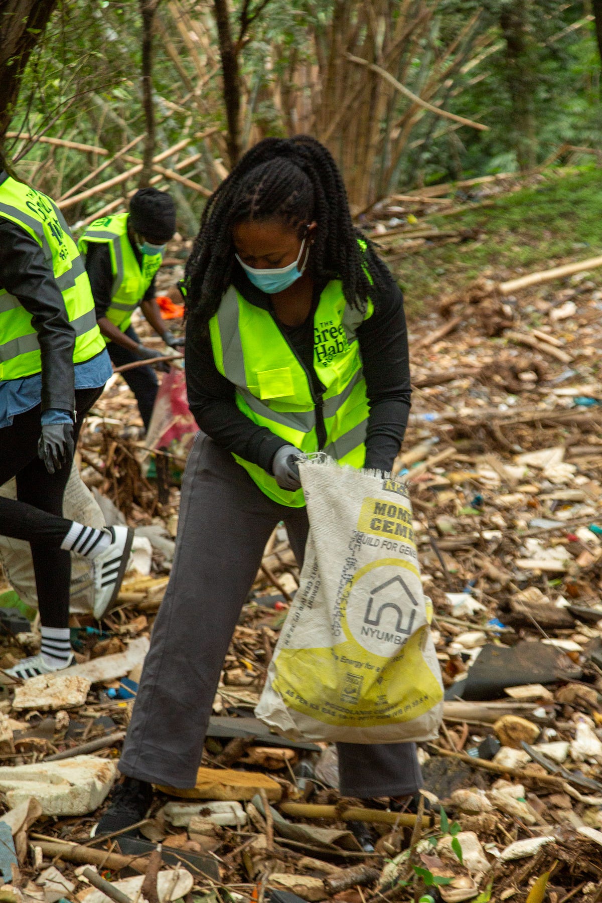 Volunteers collecting waste along the Riverbed